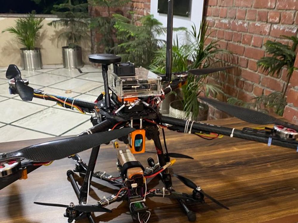 A large multirotor drone Deepak built, with its flight electronics and GPS mast on top