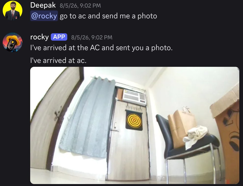 Discord chat: Deepak asks @rocky to go to the AC and send a photo; Rocky replies that it has arrived and attaches the photo it took from its camera